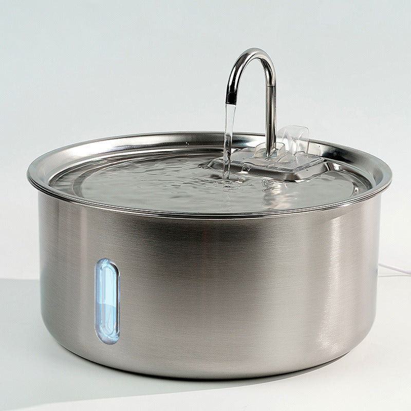 Dog using stainless steel pet water fountain